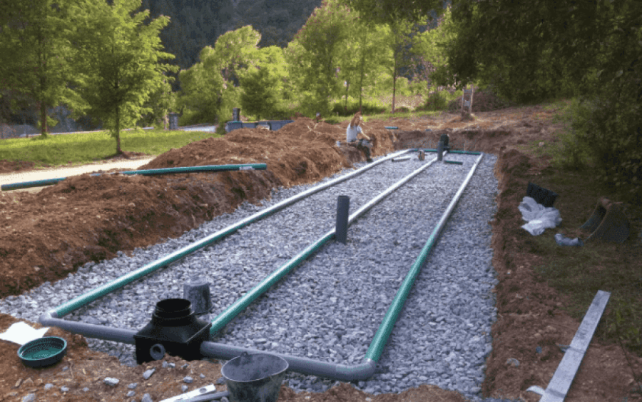 Drainage field installation team working on site